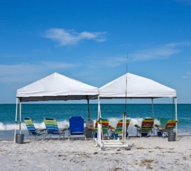 beach cabana with chairs and fishing gear | Sunset Vacations