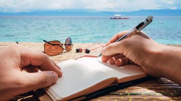 Writing Notes on the Beach | Sunset Vacations